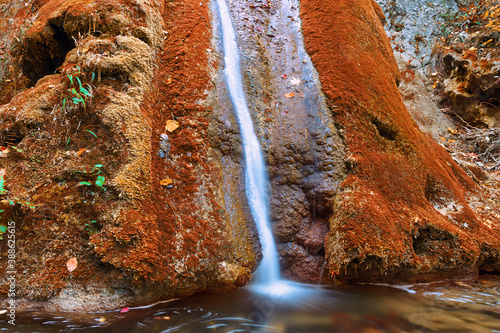 Susara waterfall flowing in autumn season photo