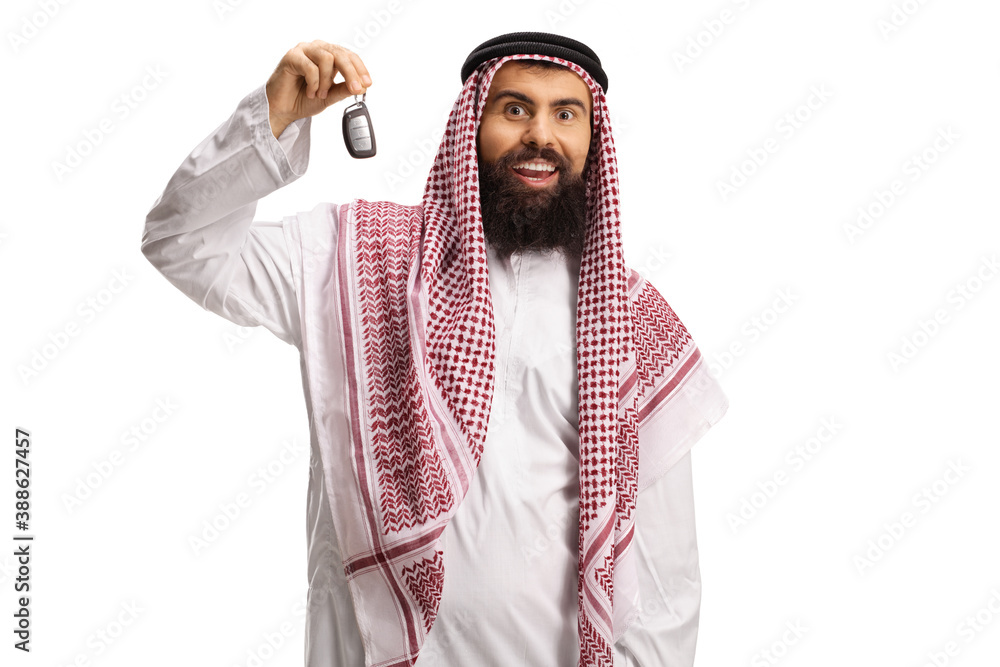 Excited arab man in a thobe showing car keys