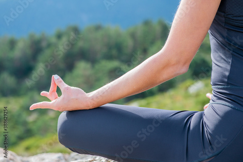 woman meditating yoga mountain postures