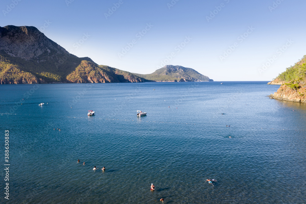 Adrasan bay is a beautiful location in the Mediterranean, with its long beach and scenery. Aerial view with drone. Antalya, TURKEY Adrasan bay is a beautiful location in the Mediterranean, with its long beach and scenery. Aerial view with drone. Antalya, TURKEY