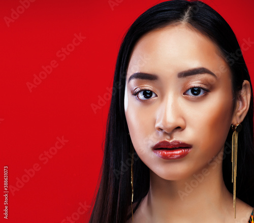 Bild auf Leinwand beauty young asian girl with fashion make up on red background , beauty stylish
