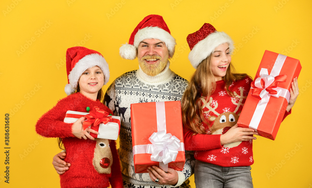 Family shopping. Christmas sale. Dad kids having fun. Father and little daughters celebrate new year together. Christmas becomes special with children. Christmas eve concept. Presents for everybody Family shopping. Christmas sale. Dad kids having fun. Father and little daughters celebrate new year together. Christmas becomes special with children. Christmas eve concept. Presents for everybody