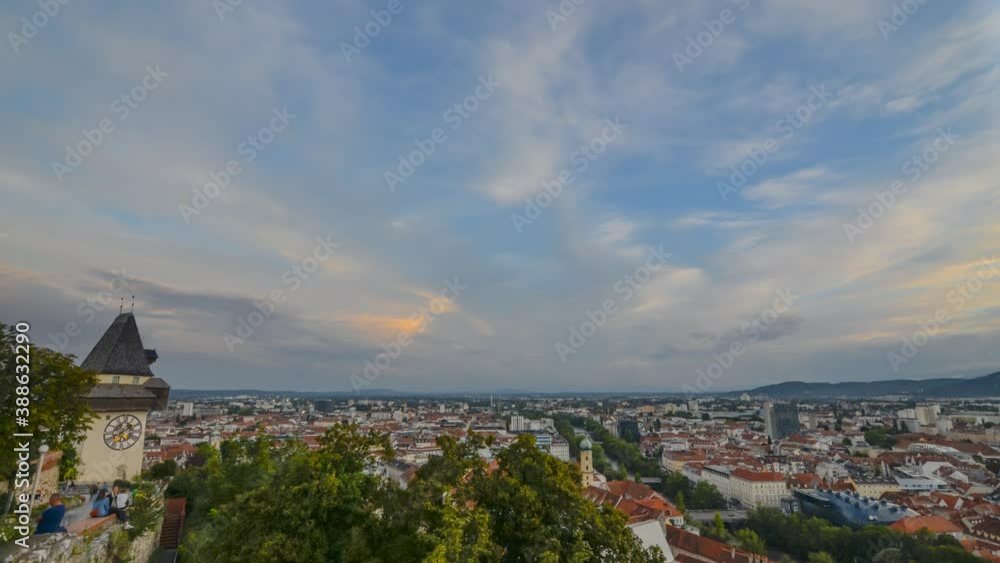 Sunset over Graz skyline 4K timelapse with famous Clock Tower on Schlossberg hill and historic buildings, in Graz, Styria region, Austria Sunset over Graz skyline 4K timelapse with famous Clock Tower on Schlossberg hill and historic buildings, in Graz, Styria region, Austria