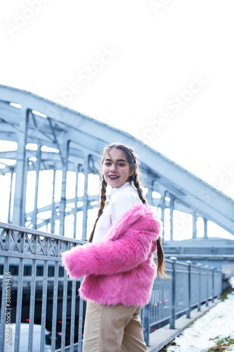 young pretty teenage girl posing cheerful happy smiling wearing street style outside in europe city, lifestyle people concept © iordani