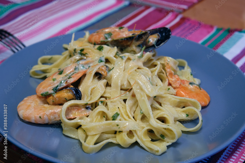 noodles with shrimp and mussels in cream sauce Stock Photo Adobe Stock
