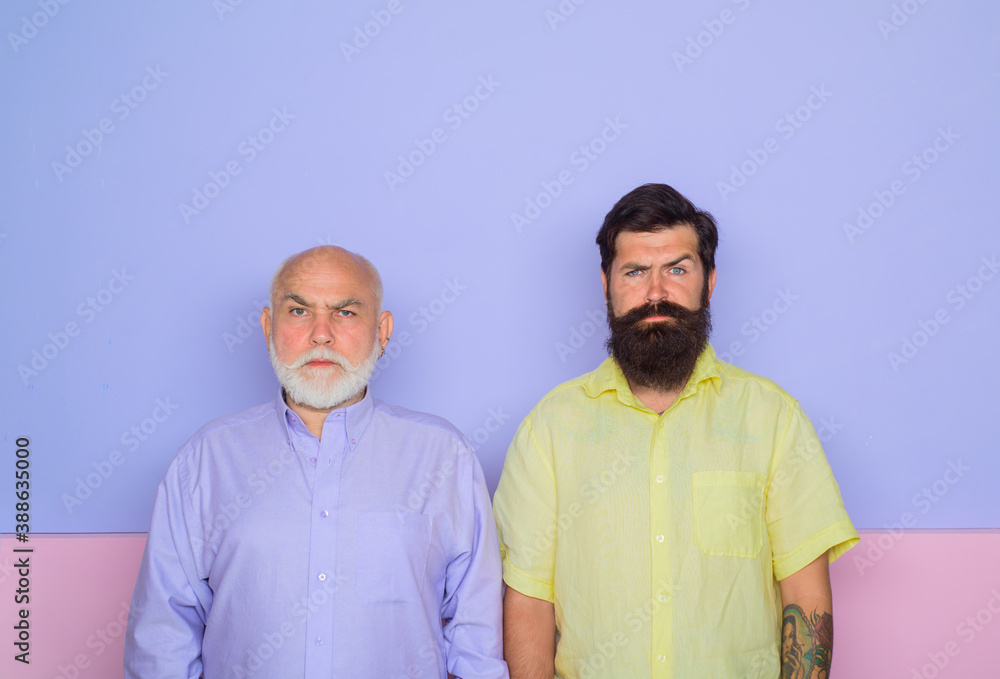 Old man and young man. Old dad and adult son. Generation. Bearded man. Two bearded man.