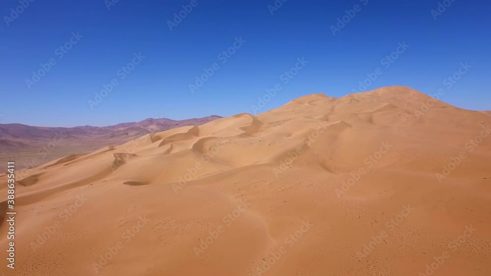 Aerial landscape shot of the golden dry sand of the Atacama desert, bright sunlight. Aerial landscape shot of the golden dry sand of the Atacama desert, bright sunlight.