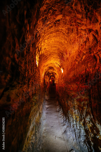 Ancient narrow underground passage in sandstone at old underground monastery