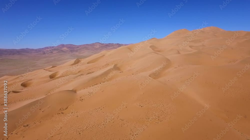 Aerial landscape shot of the golden dry sand of the Atacama desert, bright sunlight. Aerial landscape shot of the golden dry sand of the Atacama desert, bright sunlight.