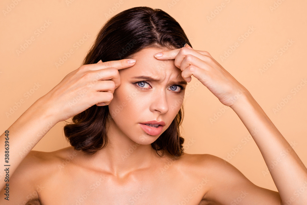 Close up photo beautiful amazing she her lady oh no disappointed irritated facial expression hands arms facial skin terrible result using cream wear no clothes isolated beige pastel background Close up photo beautiful amazing she her lady oh no disappointed irritated facial expression hands arms facial skin terrible result using cream wear no clothes isolated beige pastel background