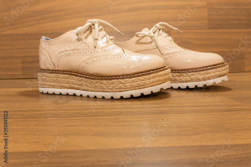 Light colored patent leather shoes. Zapatos de charol color claro. photo