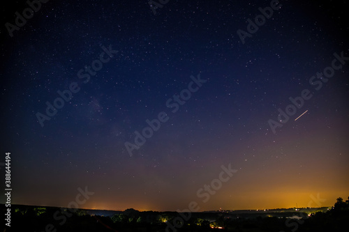 Milky Way Galaxy with stars and rural landscape