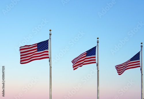 American flag of the United States of America  floating in the sky on a mast