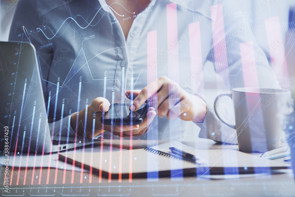 Double exposure of forex chart sketch hologram and woman holding and using a mobile device. Financial market concept. Double exposure of forex chart sketch hologram and woman holding and using a mobile device. Financial market concept.