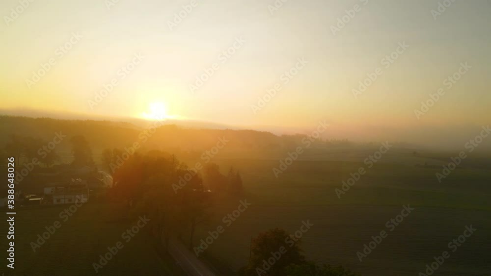 Golden Sunrise Over Small Village And Fields In Napromek, Poland. - aerial drone shot Golden Sunrise Over Small Village And Fields In Napromek, Poland. - aerial drone shot