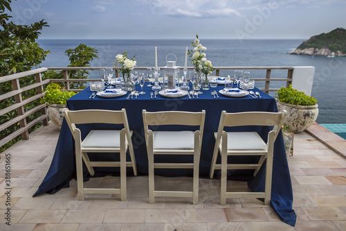 Blue and Silver Romantic Wedding Table Top Layout Table Spread no people no human tropical location with the sea with copy space