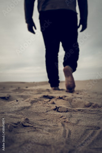 man walking in the sahara