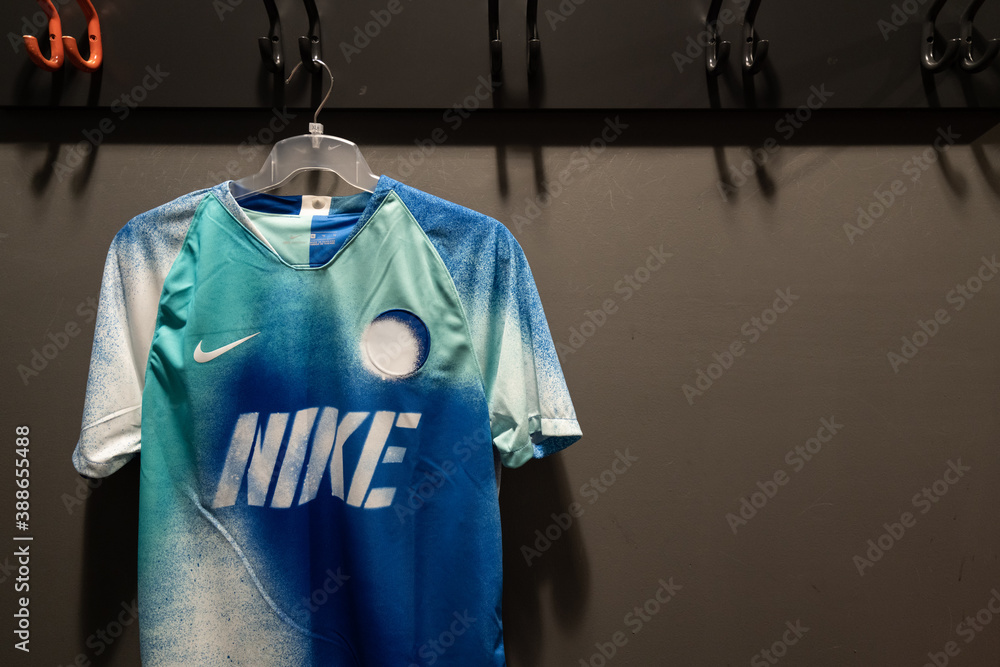 Bangkok / Thailand - November 2019 : Nike FC special edition football  jersey in Blue/Green colorful is hanging