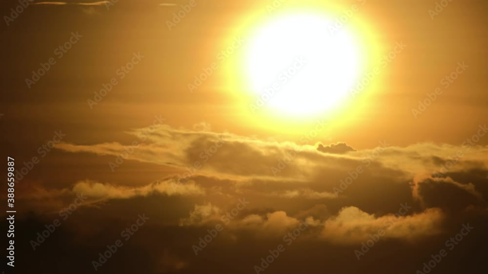 Close up sunrise shot of the sun with fast moving clouds. No people. Telephoto. 4k. Close up sunrise shot of the sun with fast moving clouds. No people. Telephoto. 4k.