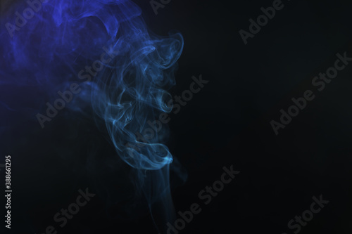 Movement color smoke girl black background with copy space.