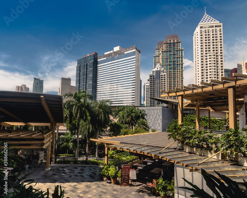 Makati, Metro Manila, Philippines - Oct 2020: The Makati Syline as seen from Greenbelt 3, an upscale mall with green spaces and al fresco dining. photo