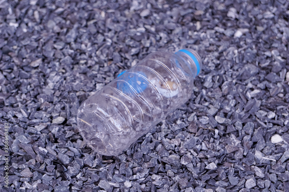 Plastic water bottles are left on the floor. Plastic water bottles are left on the floor.