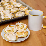 Fresh baked sweet cookies with meringue on plate