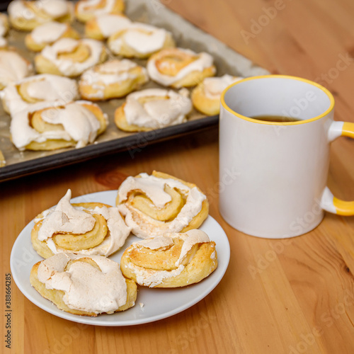 Fresh baked sweet cookies with meringue on plate