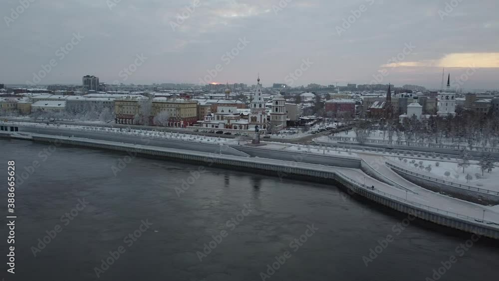 Angara River flowing through Irkutsk at sunset, snowy winter scene, aerial Angara River flowing through Irkutsk at sunset, snowy winter scene, aerial