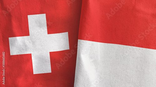 Indonesia and Switzerland two flags textile cloth 3D rendering photo