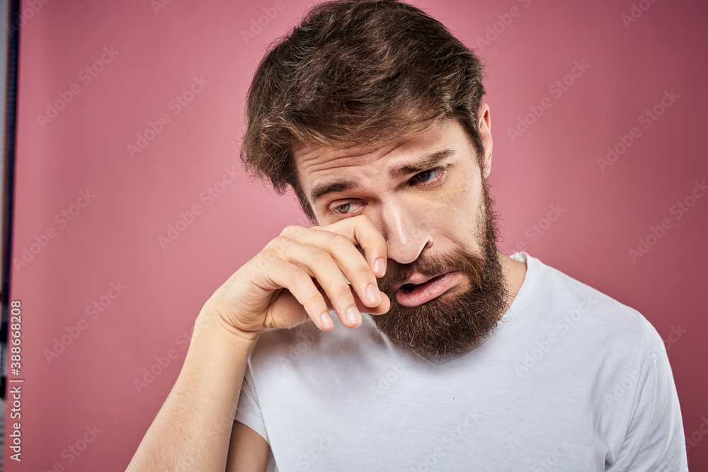 bearded man in white t-shirt emotions displeased facial expression studio pink background bearded man in white t-shirt emotions displeased facial expression studio pink background