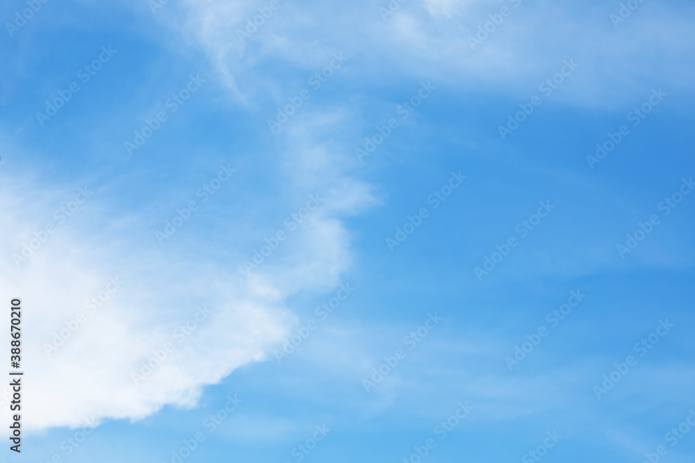 Blue sky background and white clouds soft focus, and copy space