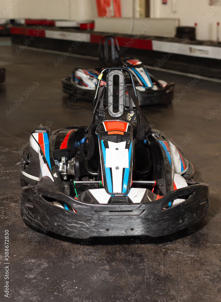 Picture of driving cars for carting in sport club indoor, no people
