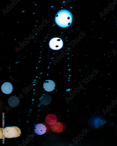 rain drops on the window with bokeh refelctions