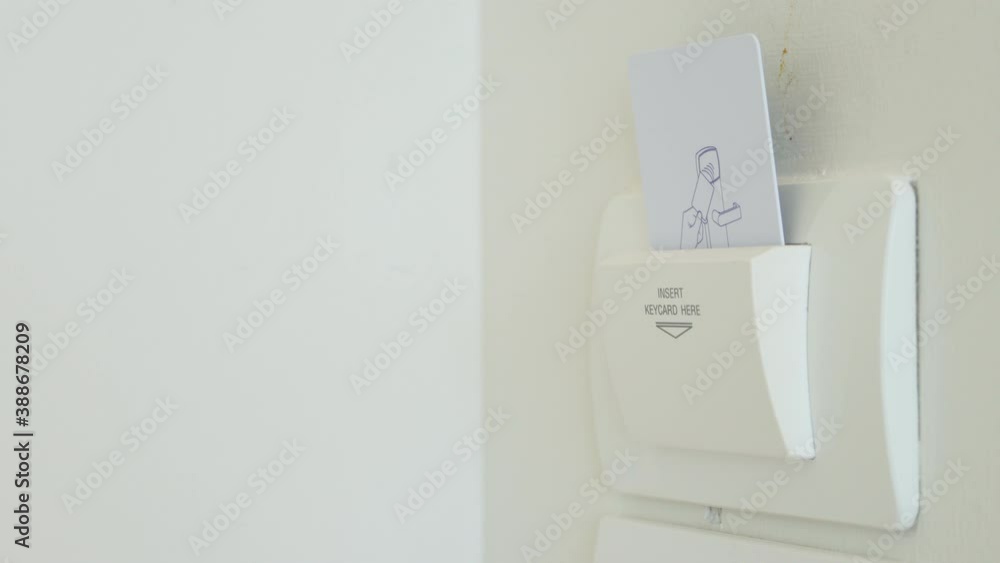 4K Video insert keycard to turn on electronic appliance in hotel room. Theme for hotel facility and ecology. 4K Video insert keycard to turn on electronic appliance in hotel room. Theme for hotel facility and ecology.