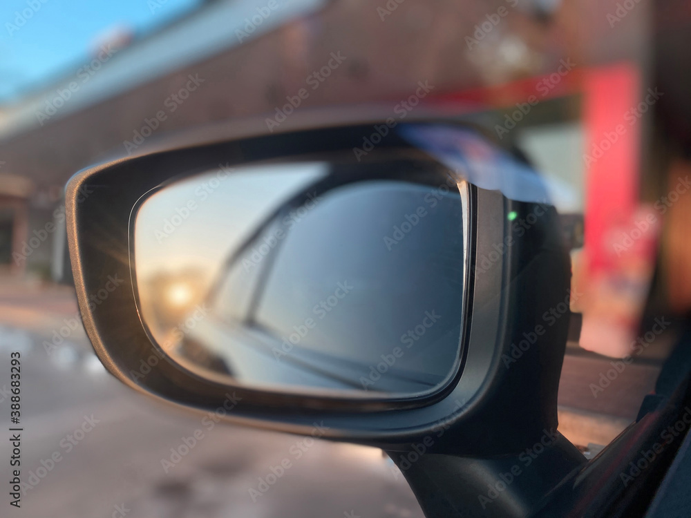 Left side mirror Reflected with the evening sun shining beautiful