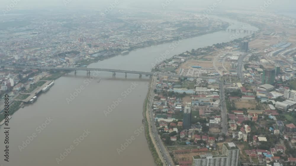Slow Aerial pan over Phnom Penh and Tonle Sap its Bridge on a polluted day Slow Aerial pan over Phnom Penh and Tonle Sap its Bridge on a polluted day