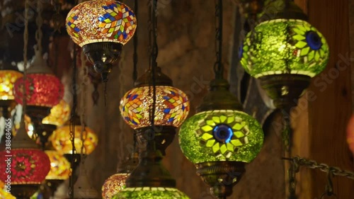 Shooting the colorful mosaic lamps hanging from the ceiling in the shop. souvenir market.turkey.