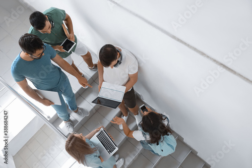 Students with modern device...