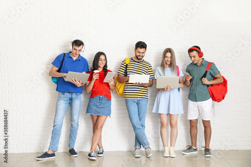 Students with modern device...