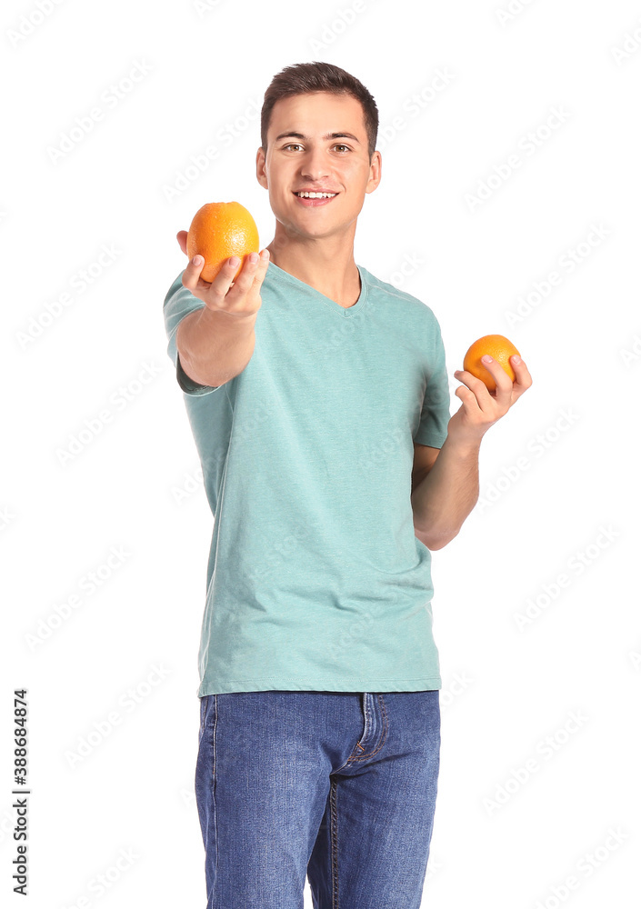 Handsome man with ripe oranges on white background Handsome man with ripe oranges on white background