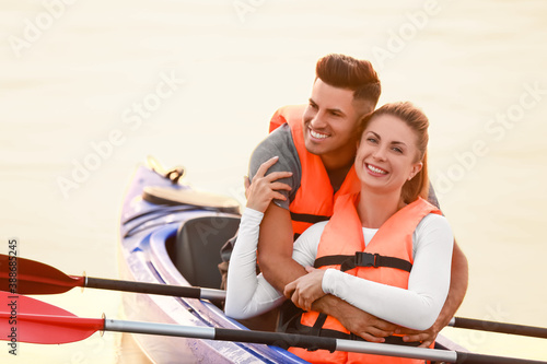 Young couple kayaking in river © Pixel-Shot