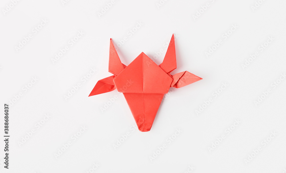 Origami bull as symbol of year 2021 on white background Origami bull as symbol of year 2021 on white background