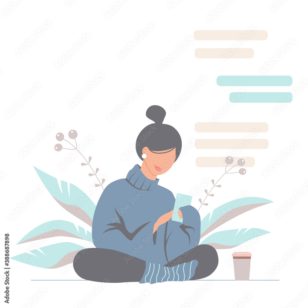 Fototapeta premium Cute young woman in a cozy sweater chating by phone. Pretty nice modern girl on a plant background.