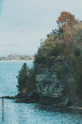 sheer cliff edge with trees and water around