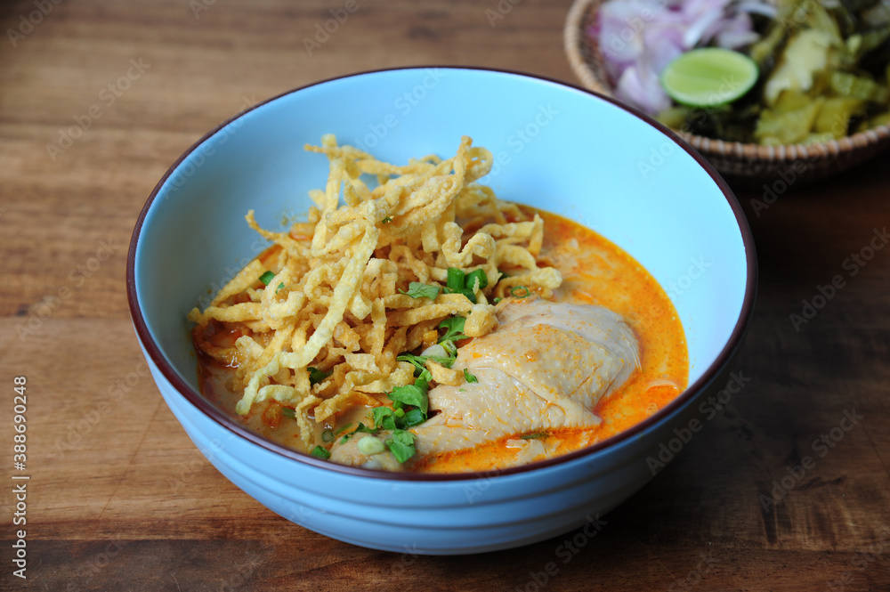 Northern Thai noodle curry soup with chicken (Kao Soi Kai) - Thai food style