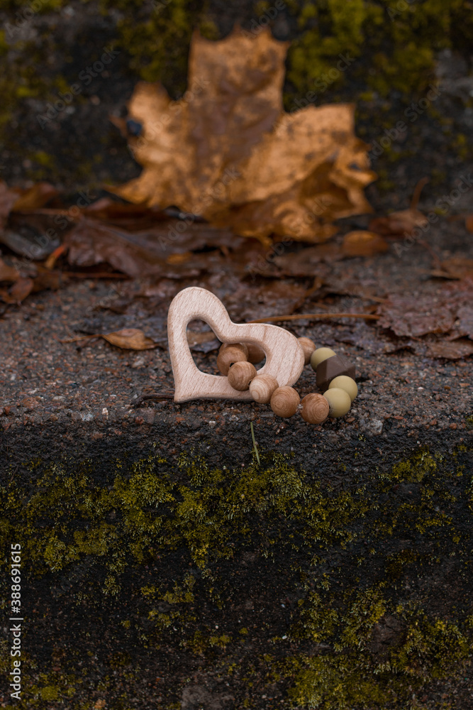 Wooden teether in the shape of a heart. Wooden teether in the shape of a heart.