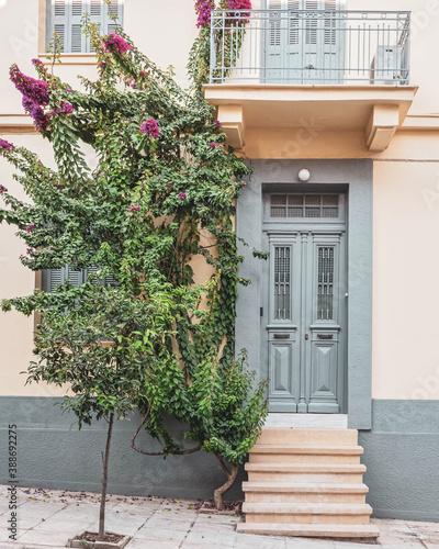 Fototapeta Naklejka Na Ścianę i Meble -  classic design house front by the sidewalk, Athens Greece