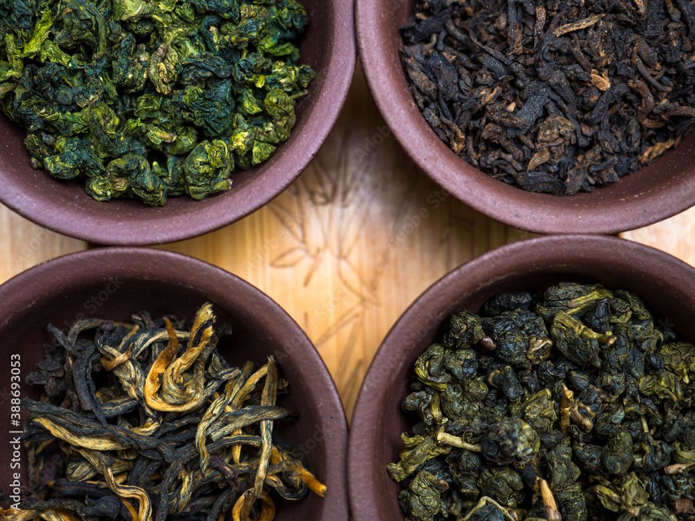 Fototapeta premium Clay cups with tea, Chinese tea ceremony