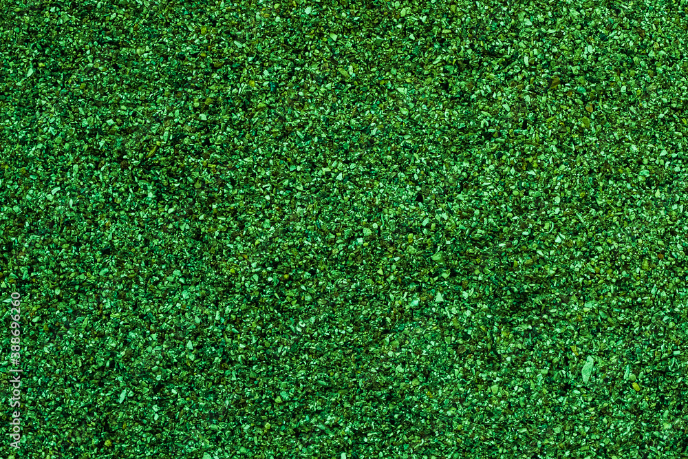 Fototapeta premium Christmas shiny green background made of small beads